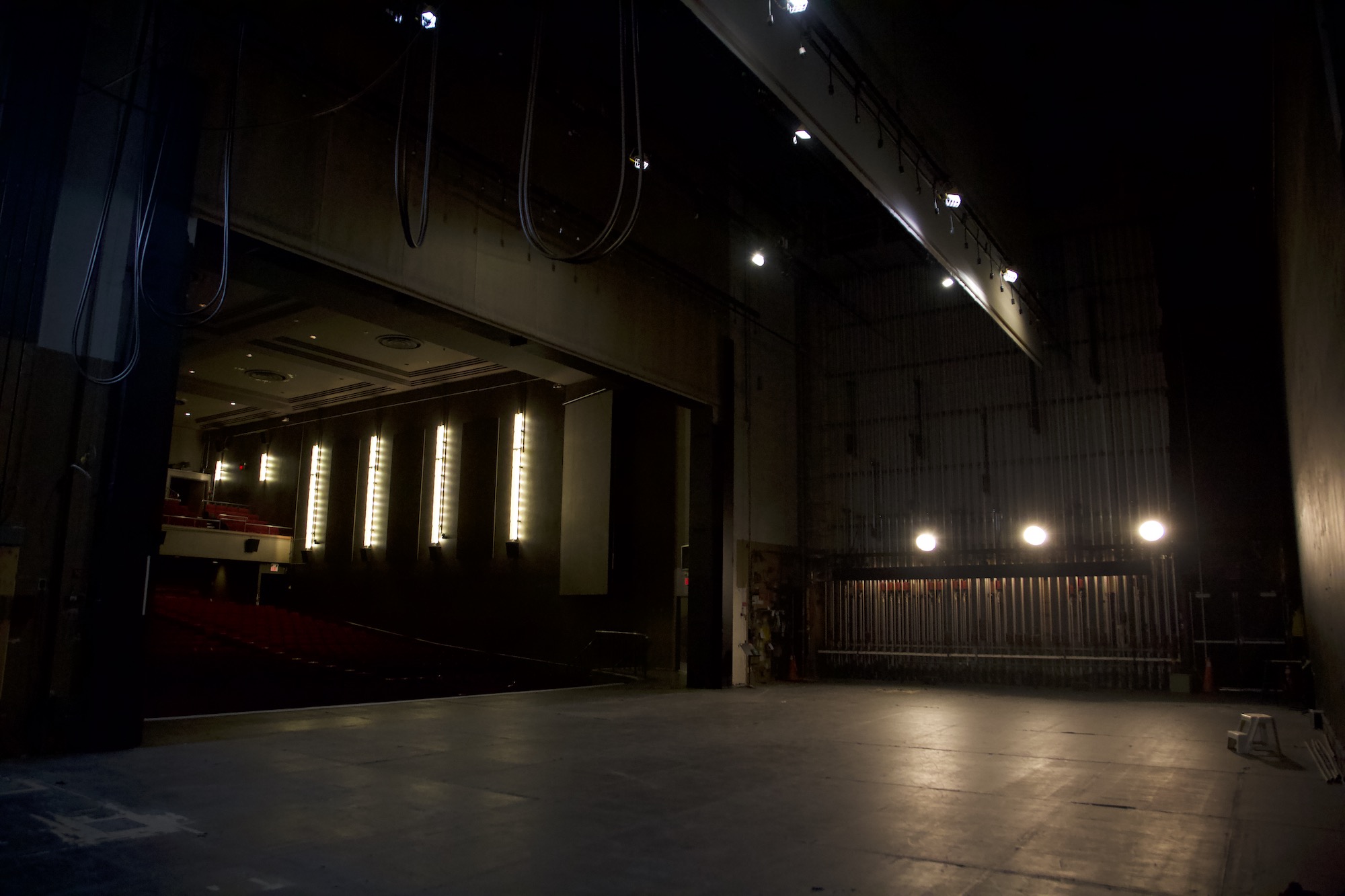 The backstage crossover at Chrysalis, house sconces glowing in the distance.