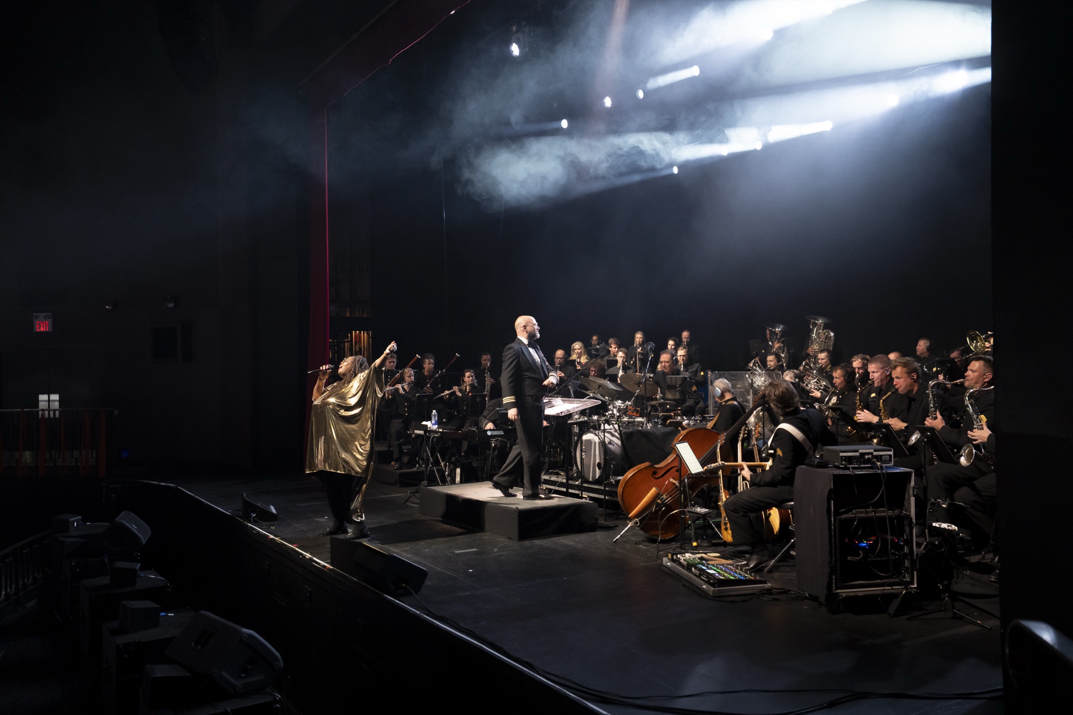 A singer performing with a full orchestra on the Chrysalis stage